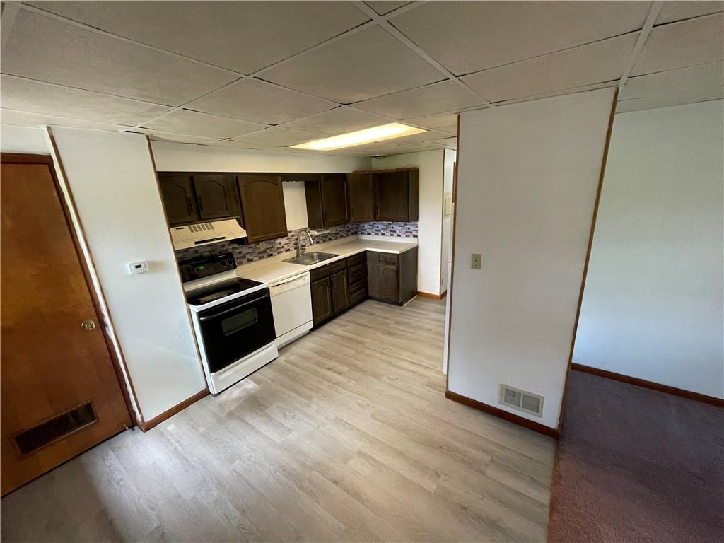 440 Steiner Bridge Road Valencia, PA 16059 - Photo 44 of 45 a kitchen with stainless steel appliances a stove and a refrigerator