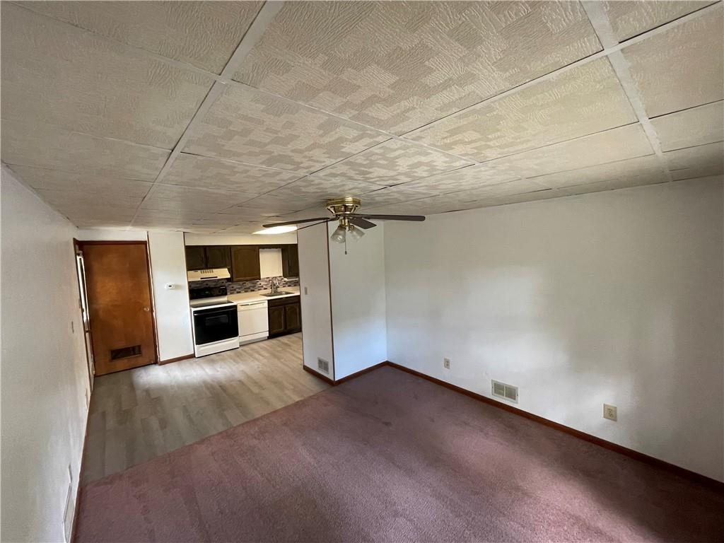 440 Steiner Bridge Road Valencia, PA 16059 - Photo 45 of 45 a view of a kitchen with refrigerator and a stove top oven