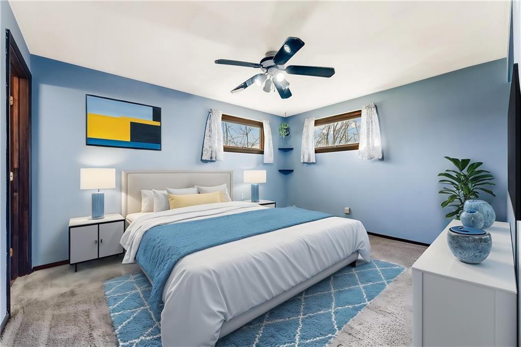 440 Steiner Bridge Road Valencia, PA 16059 - Photo 9 of 45 a bedroom with a bed and a potted plant