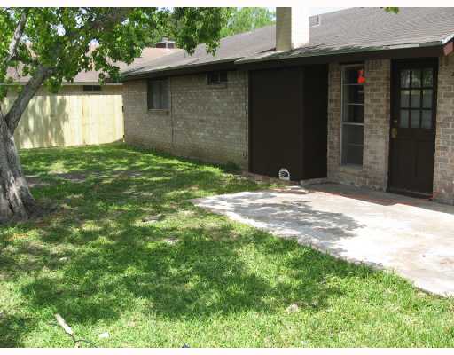 7029 Edgebrook Drive Corpus Christi, TX 78413 - Photo 3 of 3 a backyard of a house with large trees