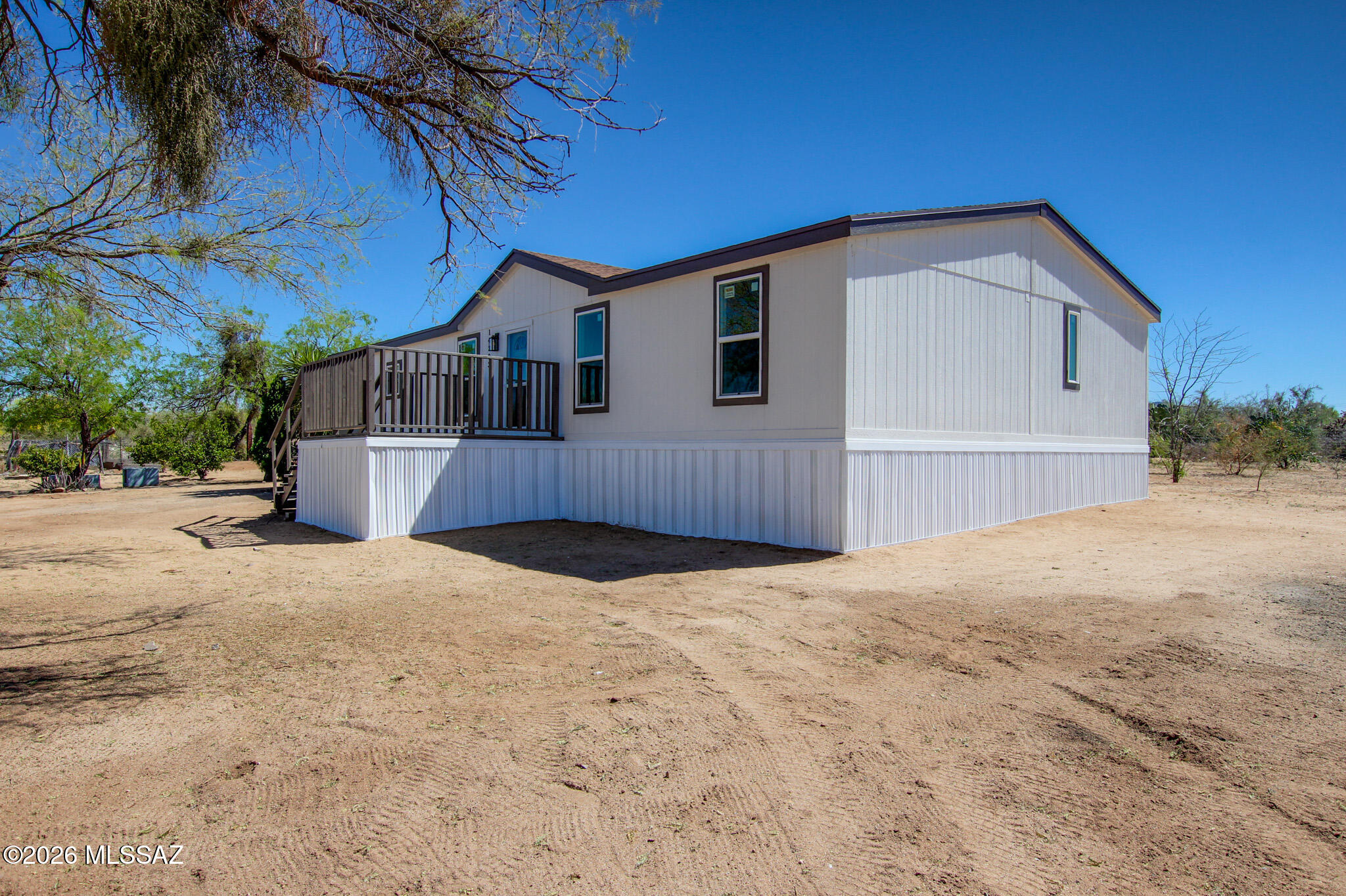 14303 West Rolina Lane Tucson, AZ 85736 - Photo 30 of 38 a front view of a house with a yard