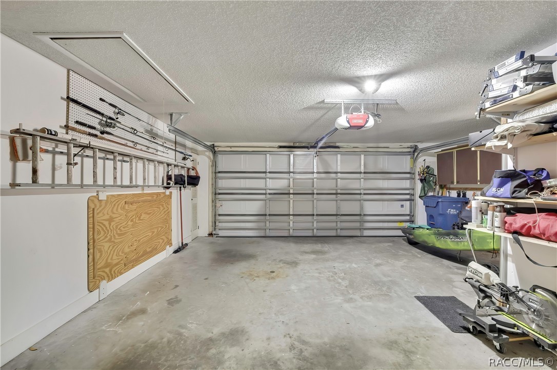 2 Quail Run Homosassa, FL 34446 - Photo 30 of 36 Garage with pull down stairs to attic