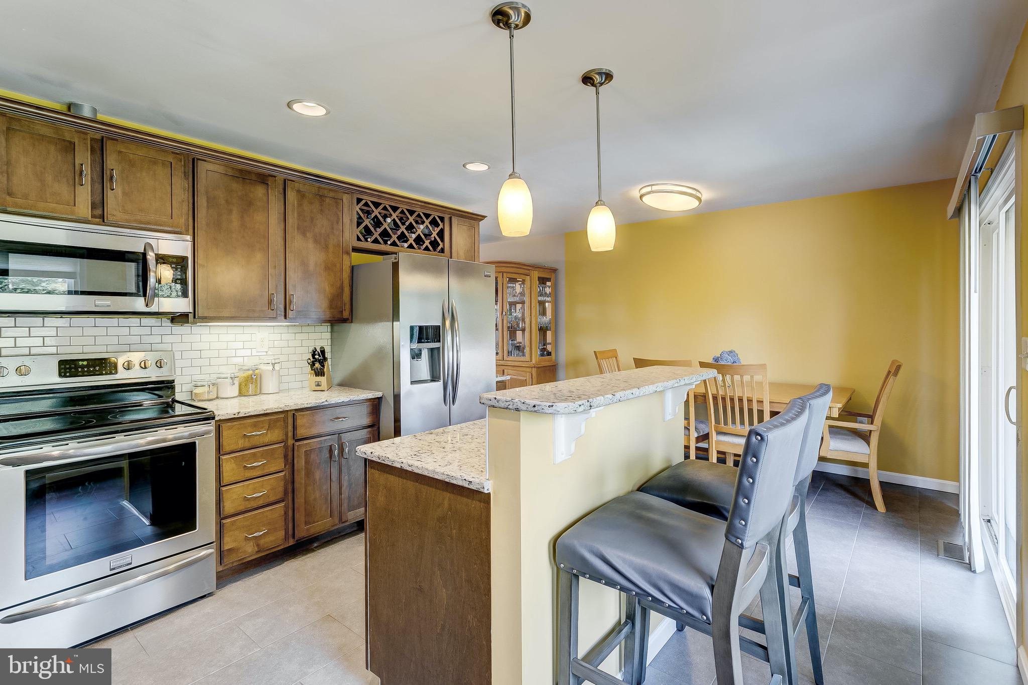 644 Jasontown Road Westminster, MD 21158 - Photo 11 of 68 Breakfast bar with overhead pendant lighting