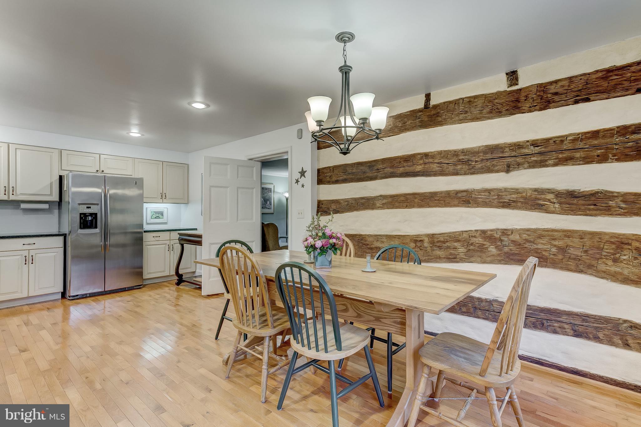 14737 Carroll Road Phoenix, MD 21131 - Photo 11 of 30 a view of a dining room with furniture and wooden floor