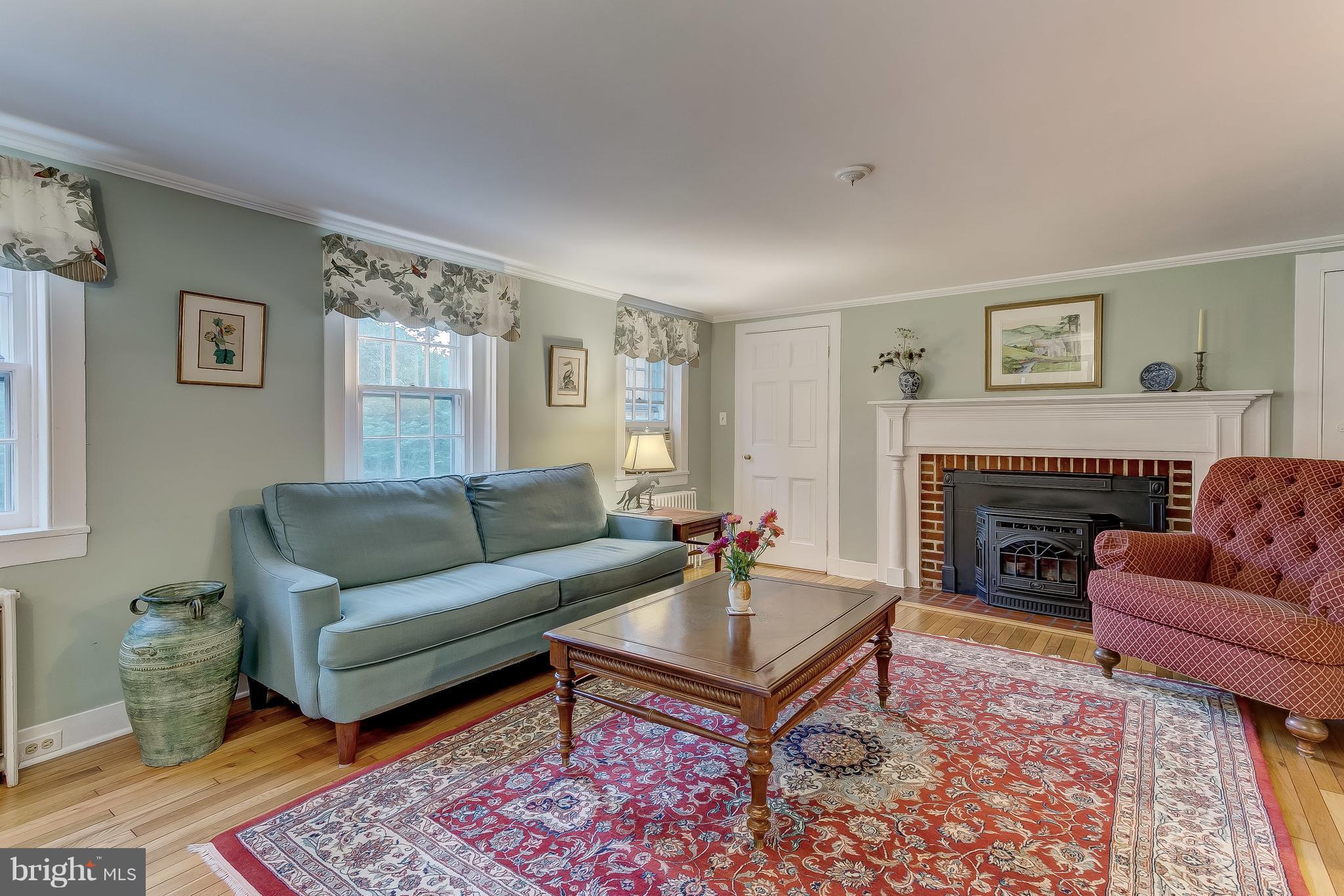 14737 Carroll Road Phoenix, MD 21131 - Photo 12 of 30 a living room with furniture and a fireplace