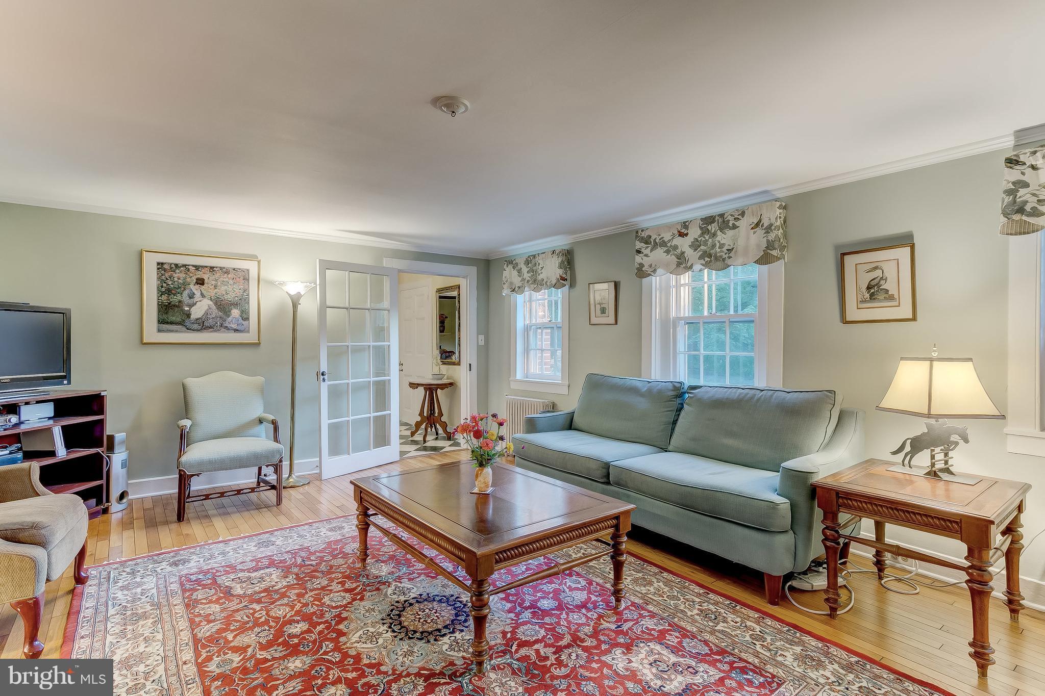 14737 Carroll Road Phoenix, MD 21131 - Photo 13 of 30 a living room with furniture a lamp a rug and a window