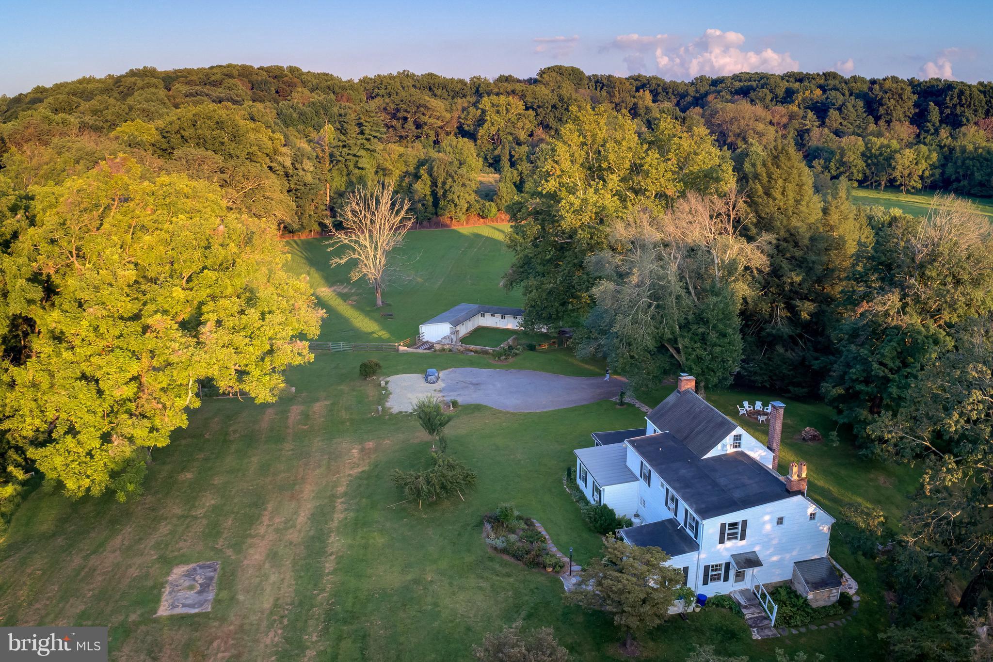 14737 Carroll Road Phoenix, MD 21131 - Photo 4 of 30 an aerial view of residential houses with outdoor space and trees