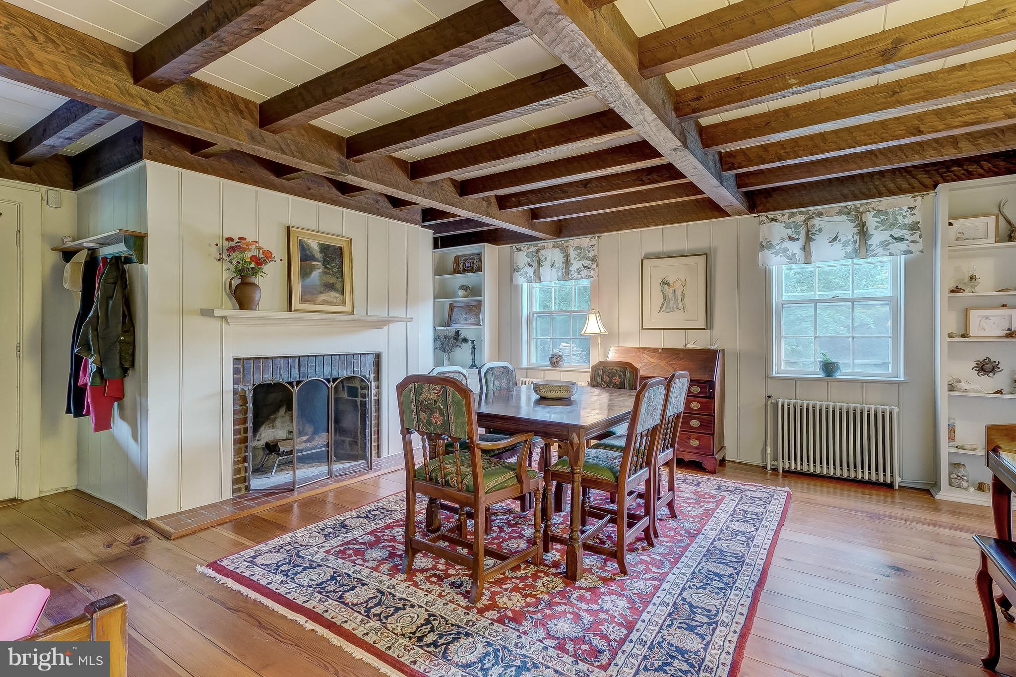 14737 Carroll Road Phoenix, MD 21131 - Photo 7 of 30 a dining room with furniture a rug and wooden floor
