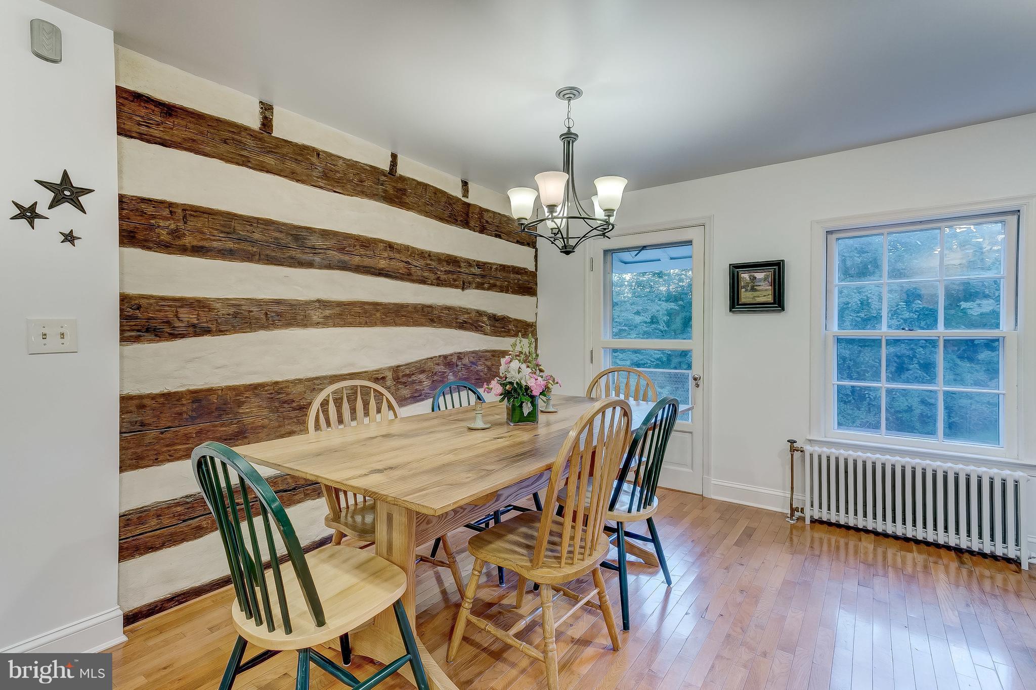 14737 Carroll Road Phoenix, MD 21131 - Photo 10 of 30 a view of a dining room with furniture and wooden floor
