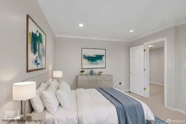 a bedroom with a bed and a lamp on table