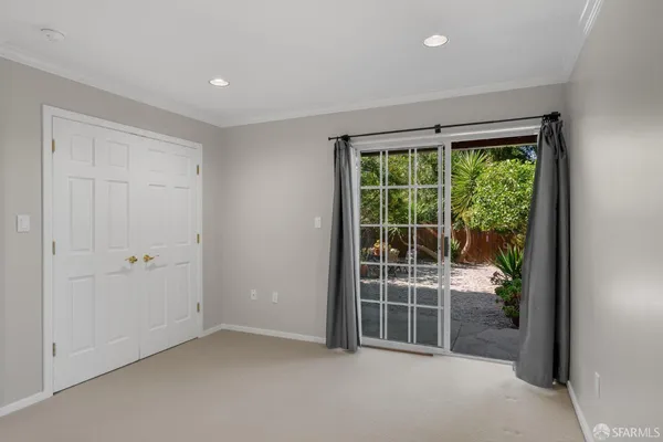 a view of empty room with floor to ceiling window