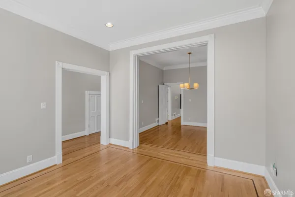 a view of hallway with wooden floor