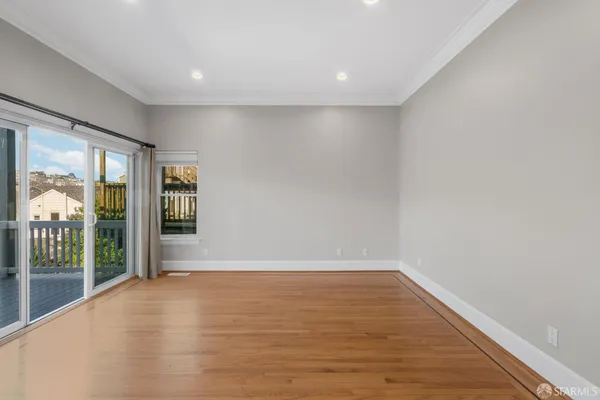 a view of an empty room with glass door