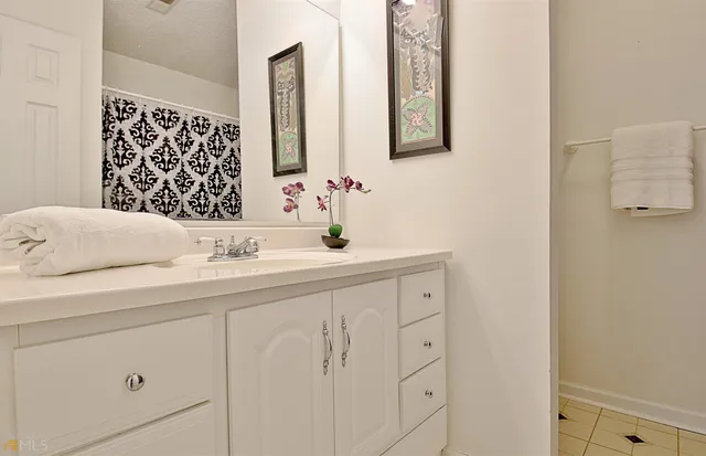 a kitchen with stainless steel appliances granite countertop a sink and a stove