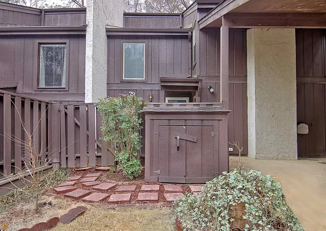 a kitchen with stainless steel appliances granite countertop a refrigerator a stove and a sink