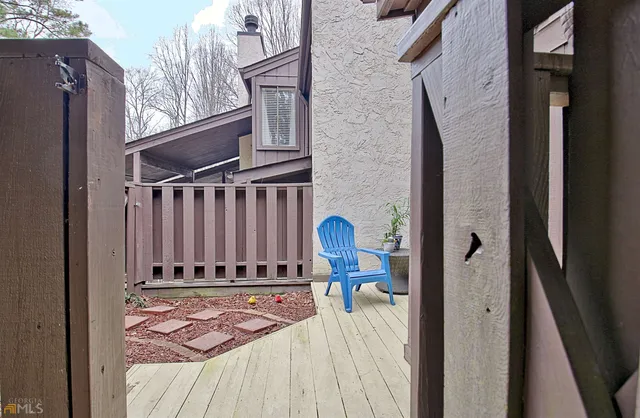 a view of staircase with white walls and a window