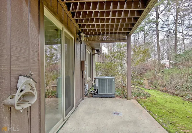 a view of a swimming pool with chairs