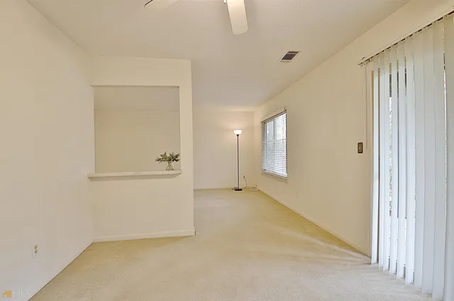 a view of swimming pool with outdoor seating and city in the background