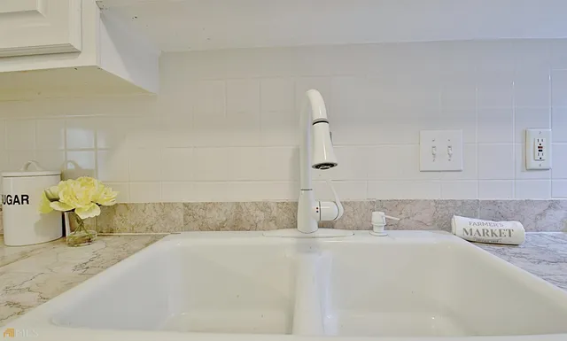 a view of an empty room with a fireplace