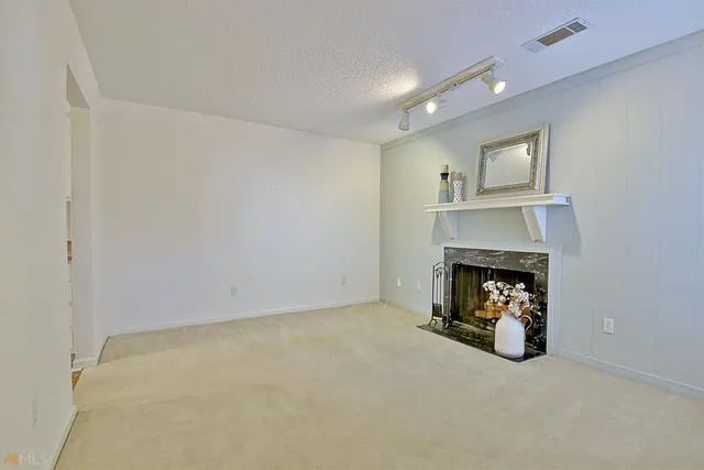 a view of staircase with white walls