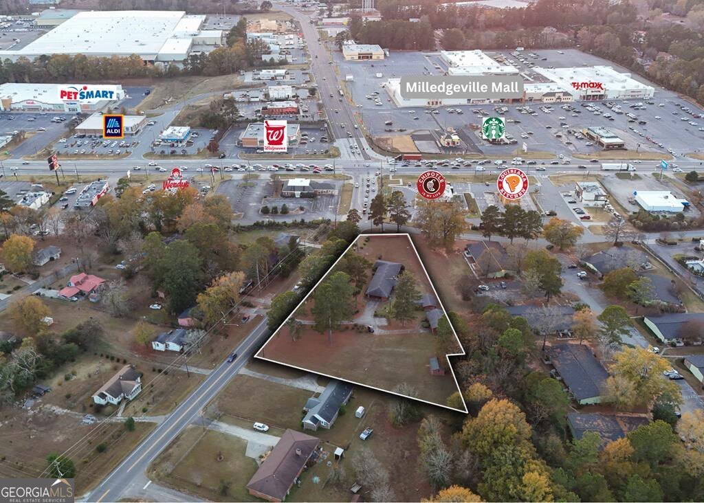 1231 Dunlap Road Northeast Milledgeville, GA 31061 - Photo 4 of 11 an aerial view of residential houses with outdoor space