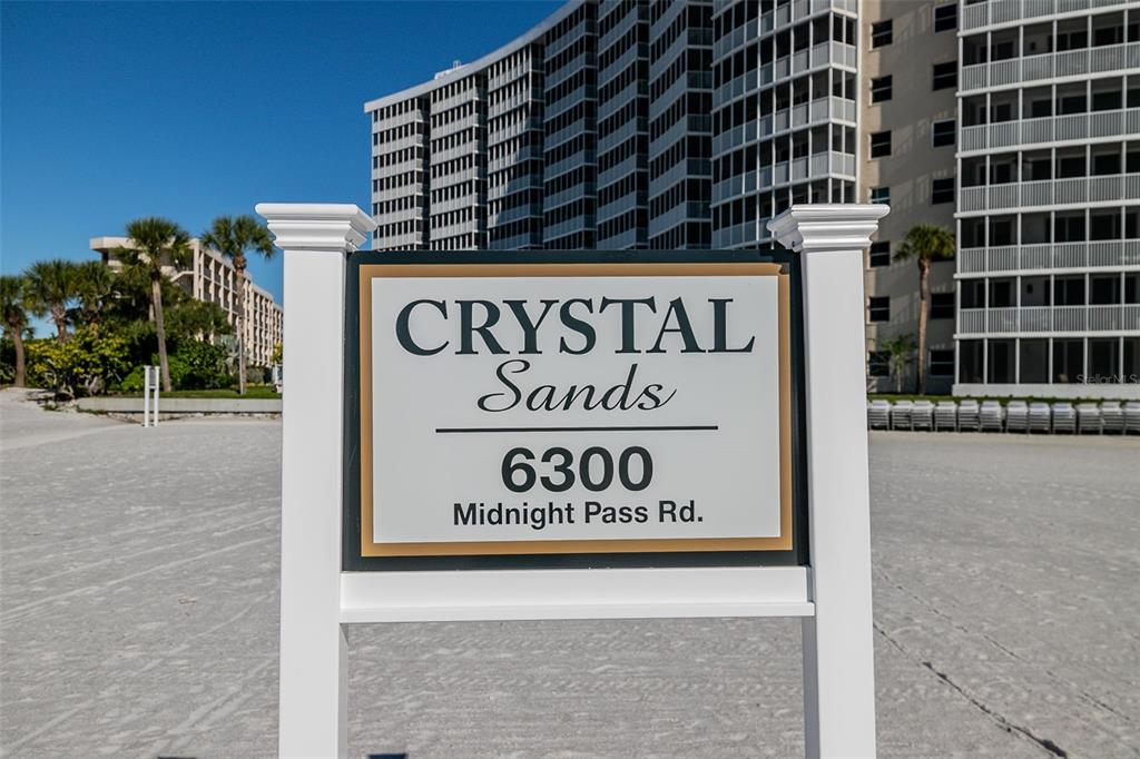 6300 Midnight Pass Road, Unit 21 Sarasota, FL 34242 - Photo 30 of 30 a building with a sign on it