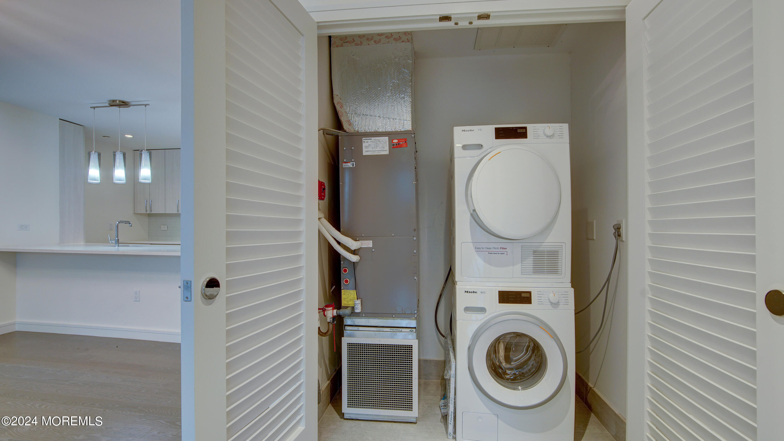 15 Morris Avenue, Unit 507 Long Branch, NJ 07740 - Photo 15 of 52 a utility room with dryer and washer