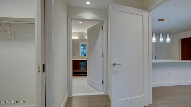 a bedroom with a large bed and a large window