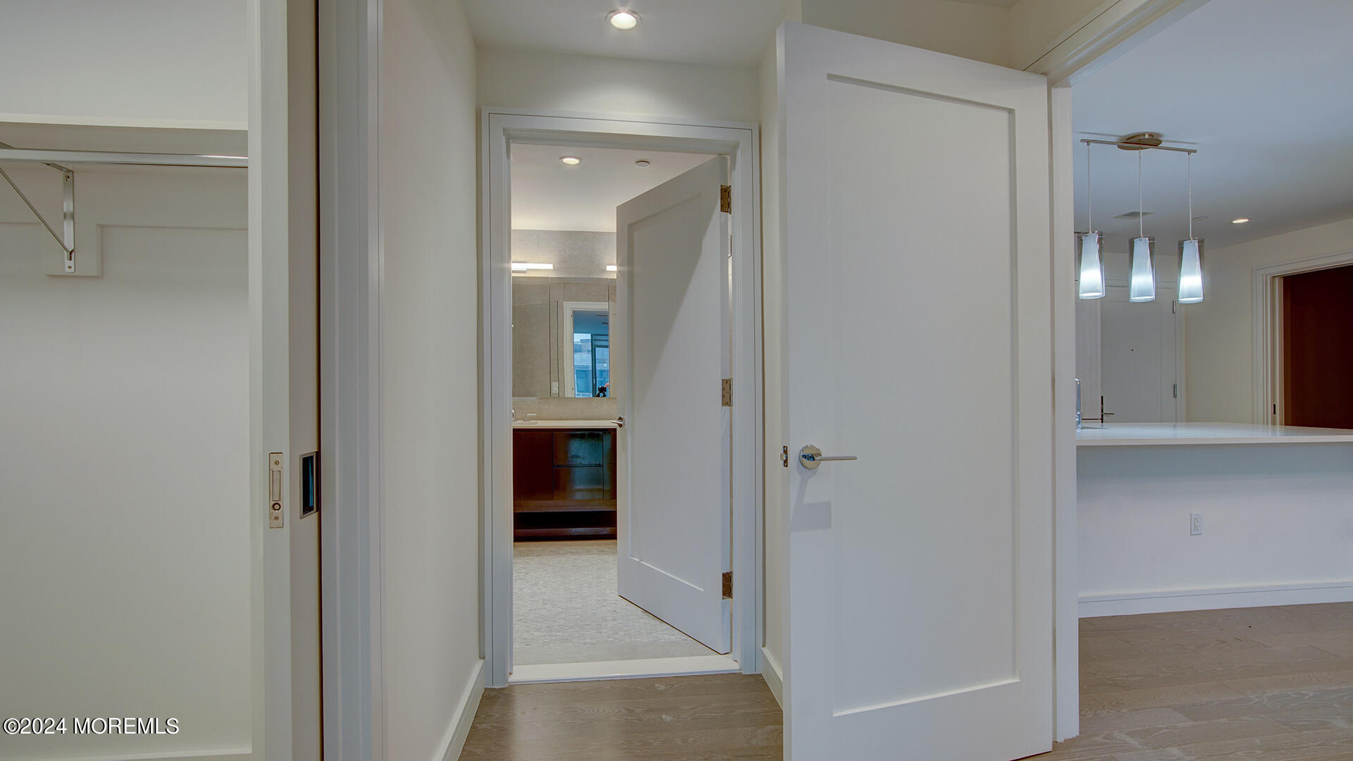 15 Morris Avenue, Unit 507 Long Branch, NJ 07740 - Photo 20 of 52 a view of a hallway with wooden shelves