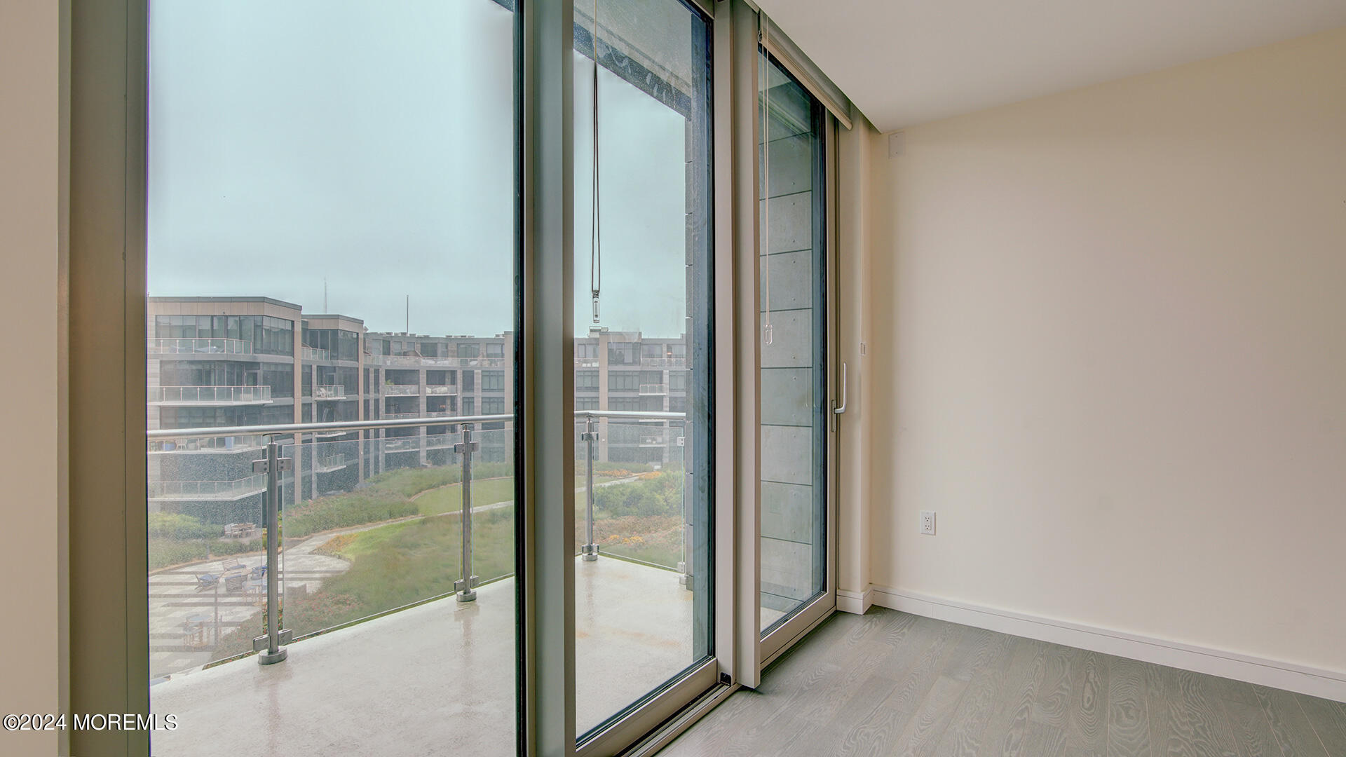 15 Morris Avenue, Unit 507 Long Branch, NJ 07740 - Photo 21 of 52 a view of a glass door and wooden floor