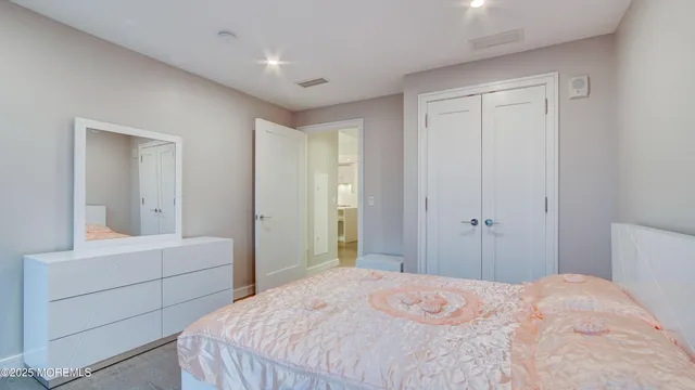a bathroom with a shower sink vanity and mirror