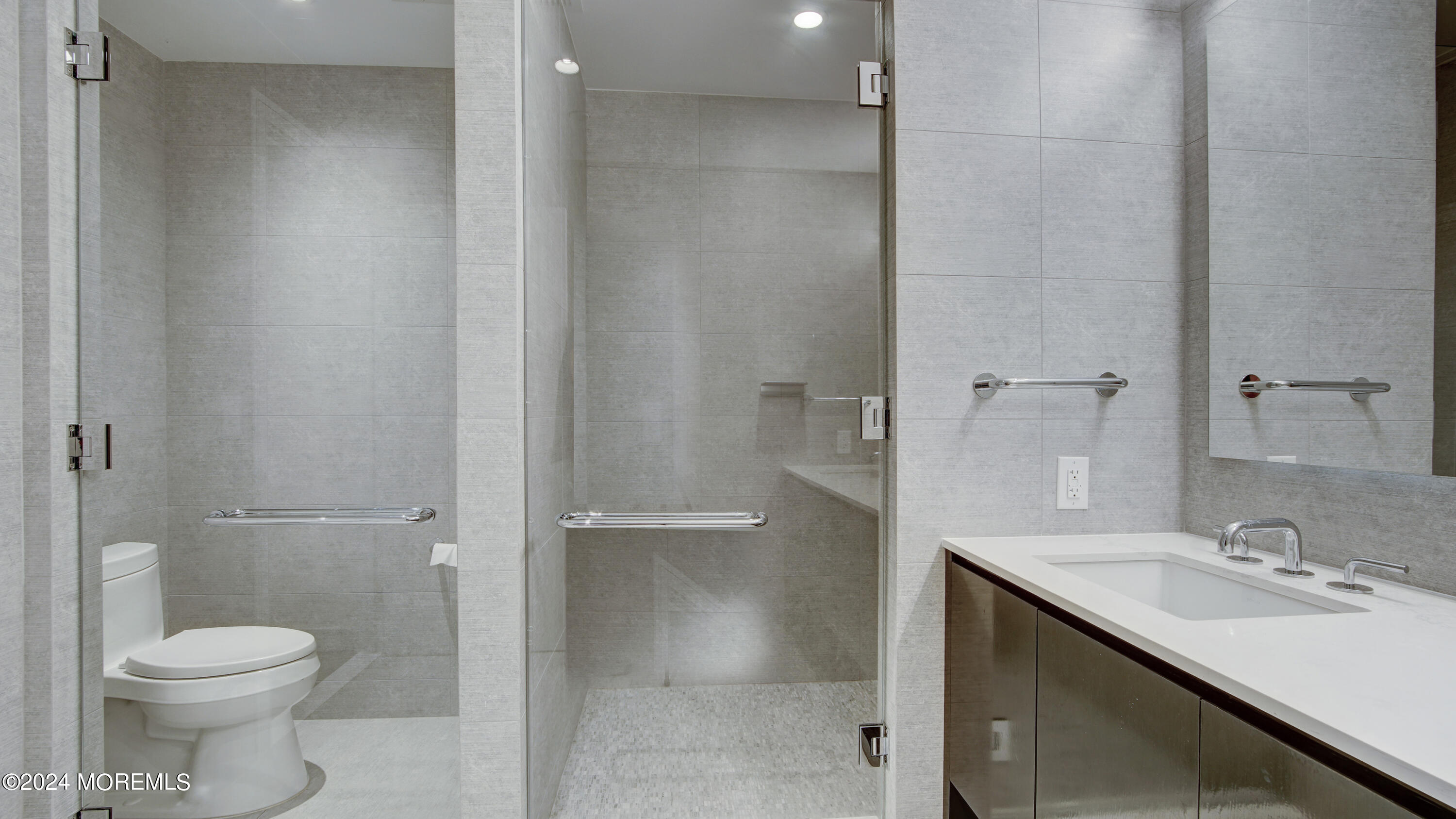 15 Morris Avenue, Unit 507 Long Branch, NJ 07740 - Photo 28 of 52 a bathroom with a sink toilet and shower