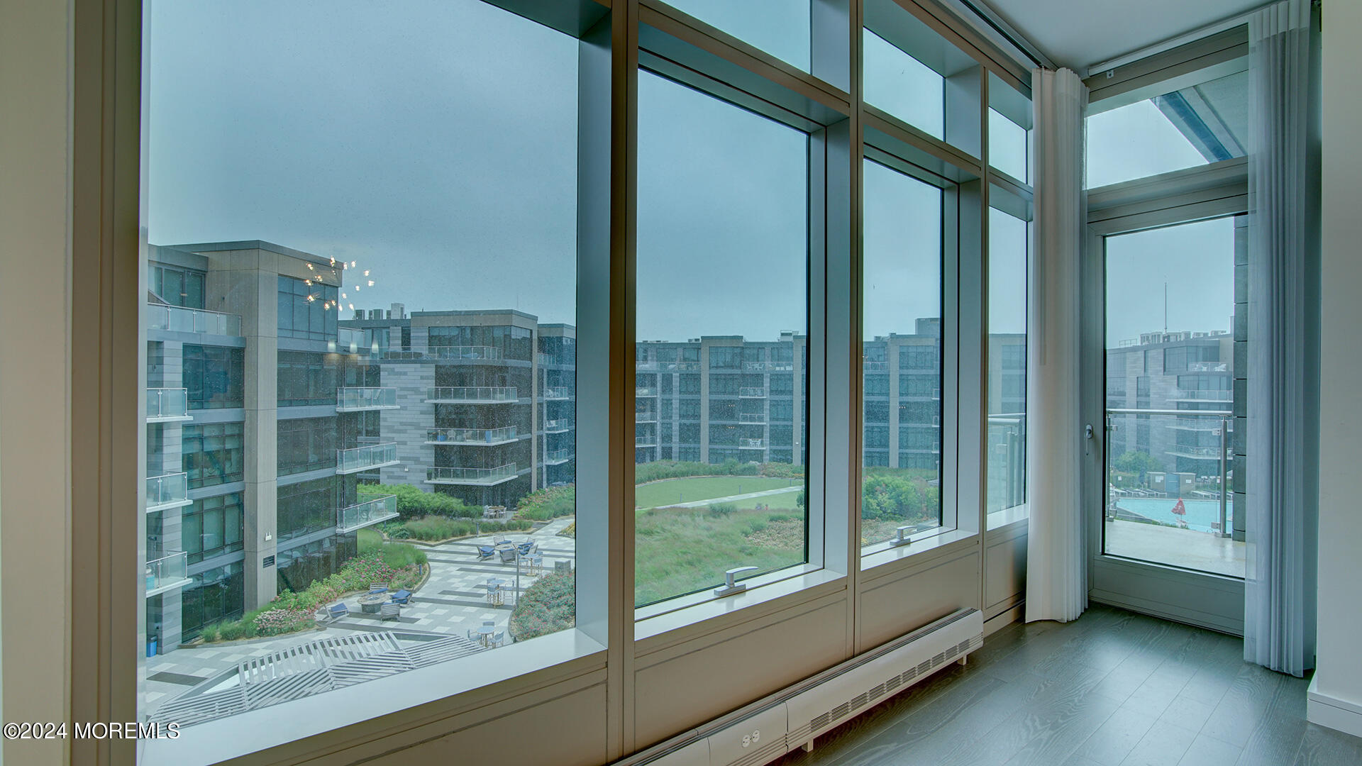 15 Morris Avenue, Unit 507 Long Branch, NJ 07740 - Photo 30 of 52 a view of a glass door and windows