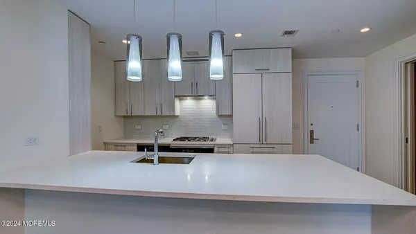 a kitchen with a stove and a sink