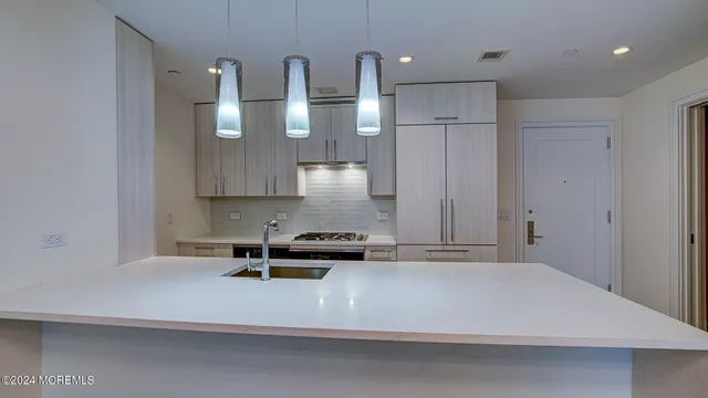 a kitchen with a stove and a sink