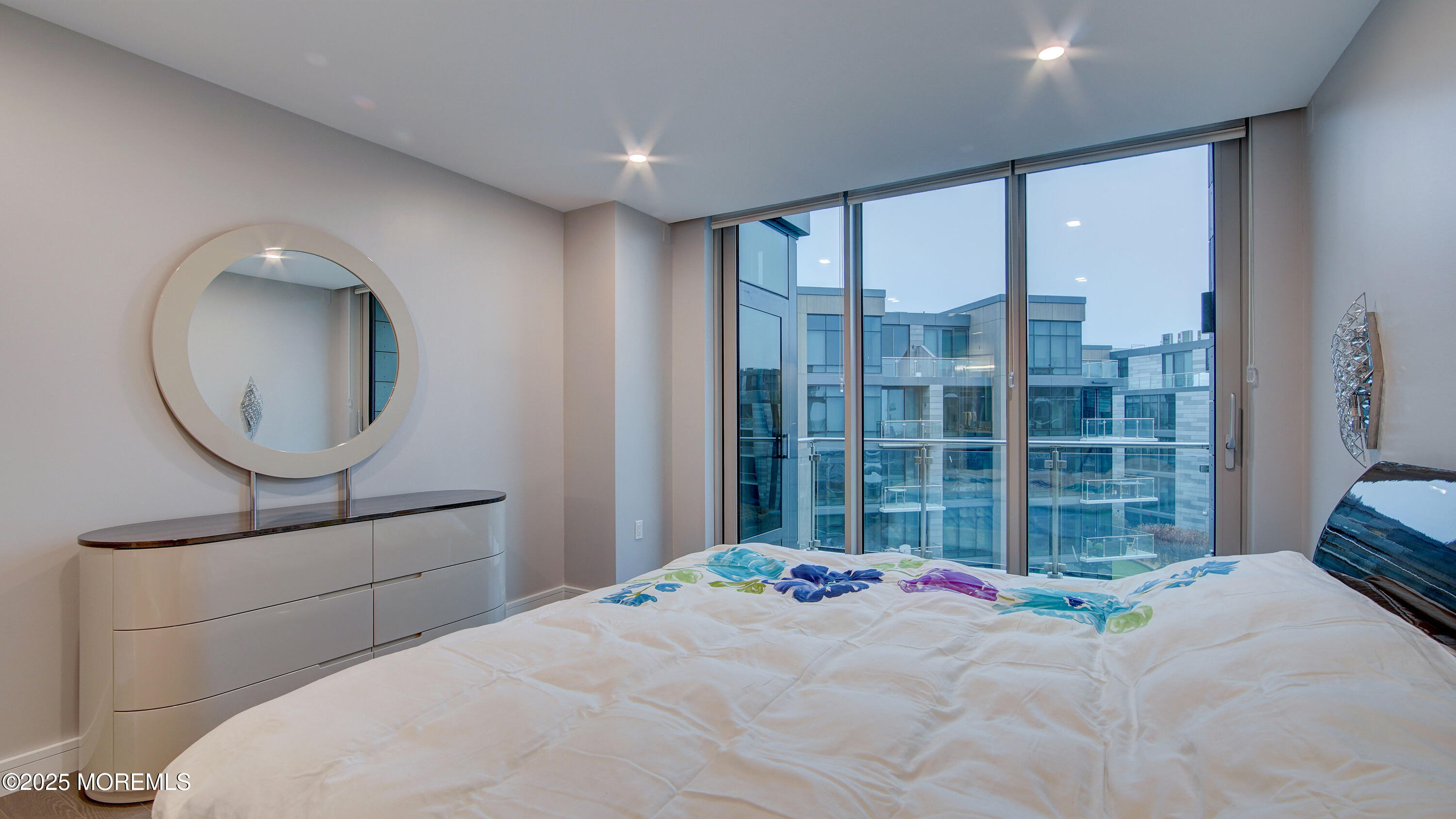 15 Morris Avenue, Unit 507 Long Branch, NJ 07740 - Photo 32 of 52 a bedroom with a bed and a large window