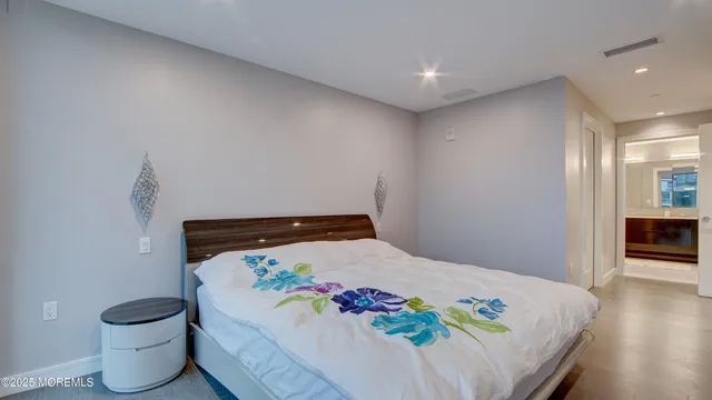 a view of a balcony with a floor to ceiling window plants and wooden floor