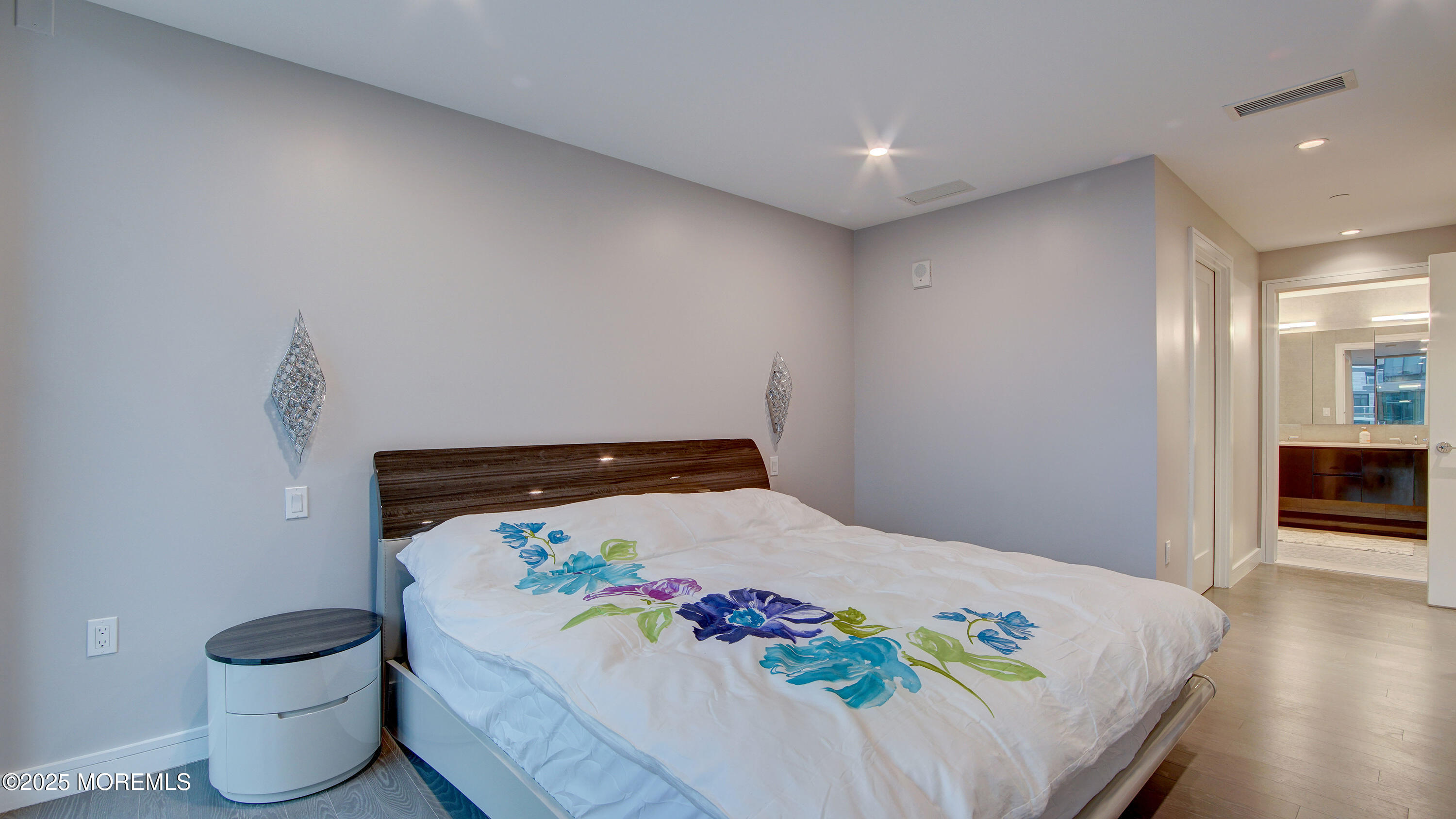 15 Morris Avenue, Unit 507 Long Branch, NJ 07740 - Photo 33 of 52 a bed sitting in a bedroom next to a window