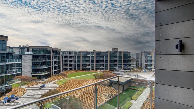 a living room with furniture and a kitchen