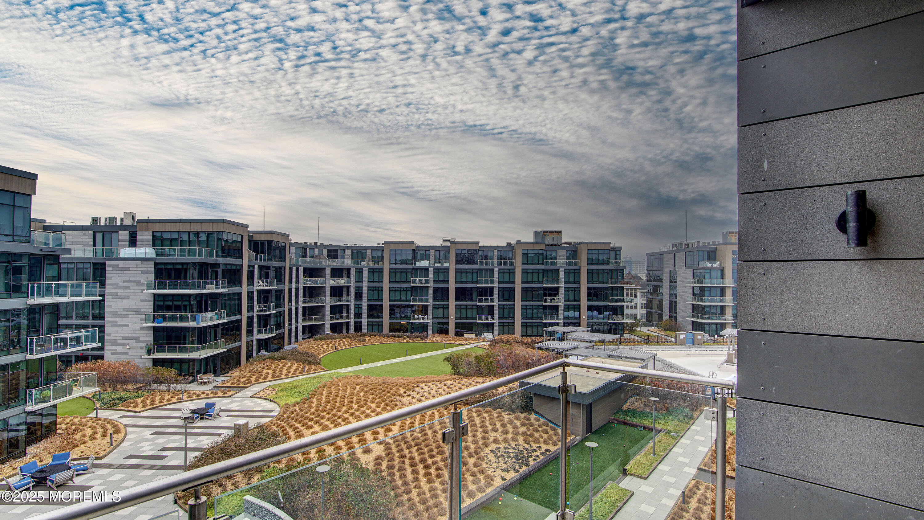 15 Morris Avenue, Unit 507 Long Branch, NJ 07740 - Photo 36 of 52 a view of a swimming pool with a lounge chair