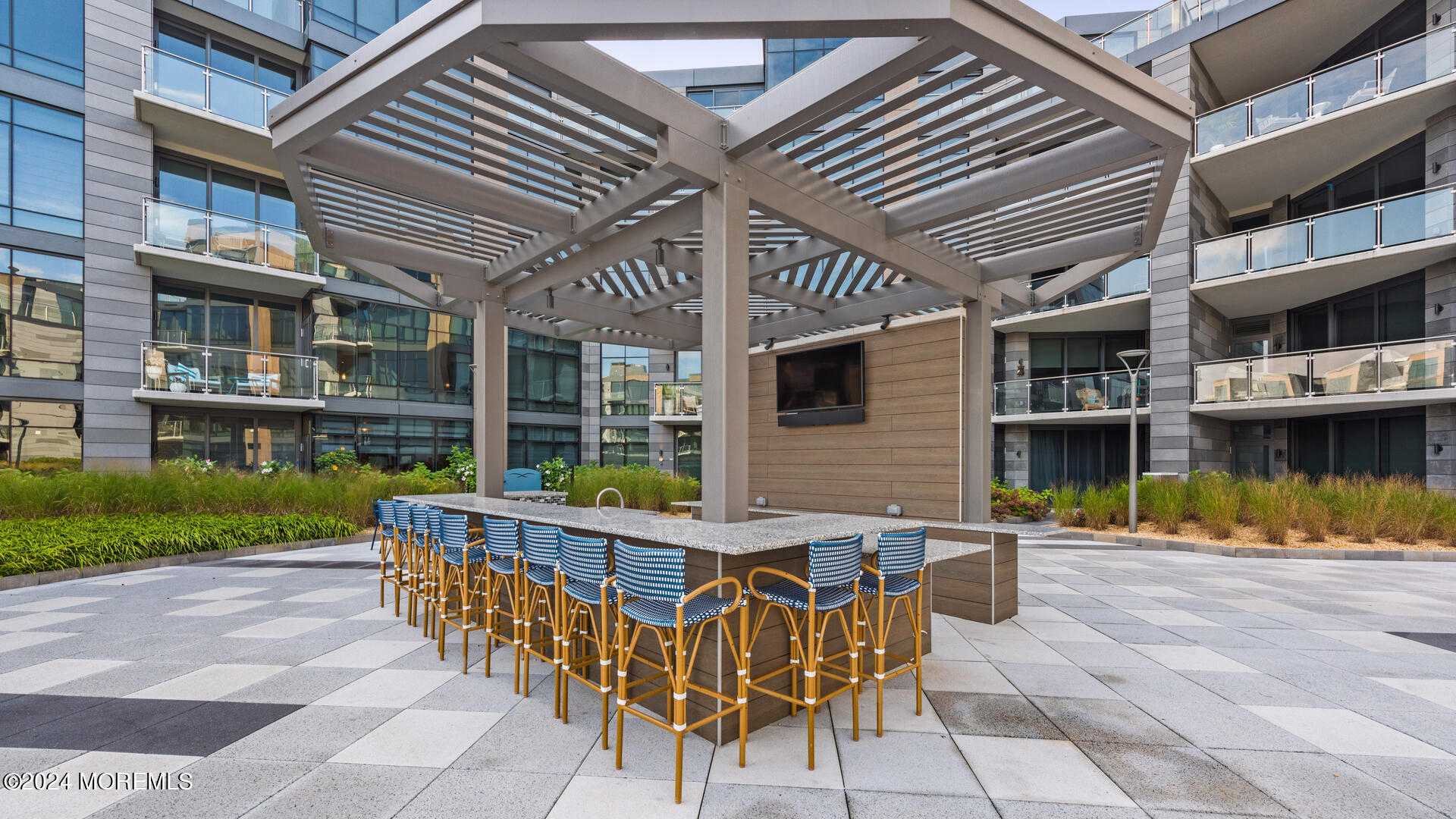 15 Morris Avenue, Unit 507 Long Branch, NJ 07740 - Photo 44 of 52 a view of a chairs and table in the patio
