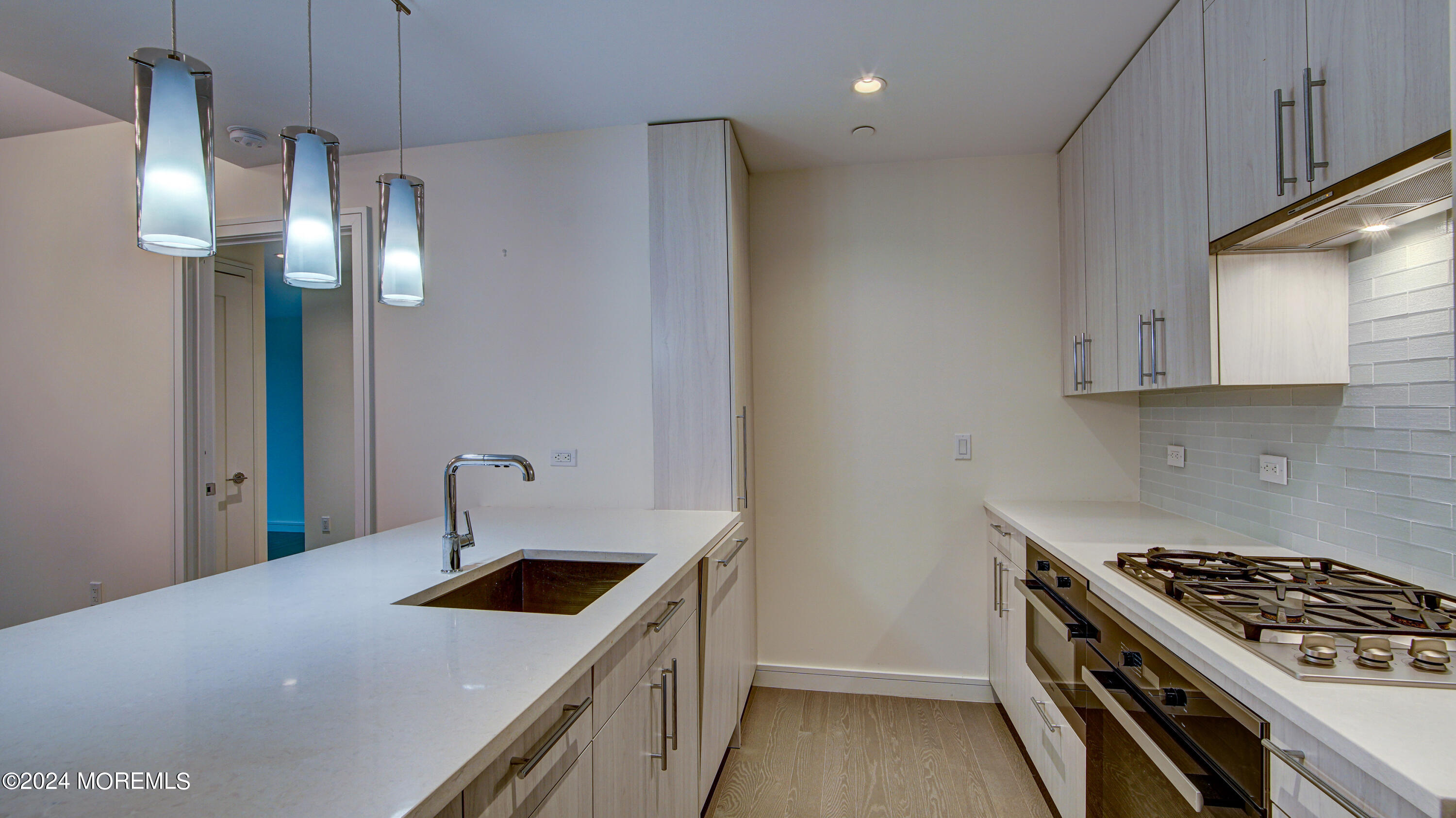 15 Morris Avenue, Unit 507 Long Branch, NJ 07740 - Photo 5 of 52 a kitchen with a stove and a sink