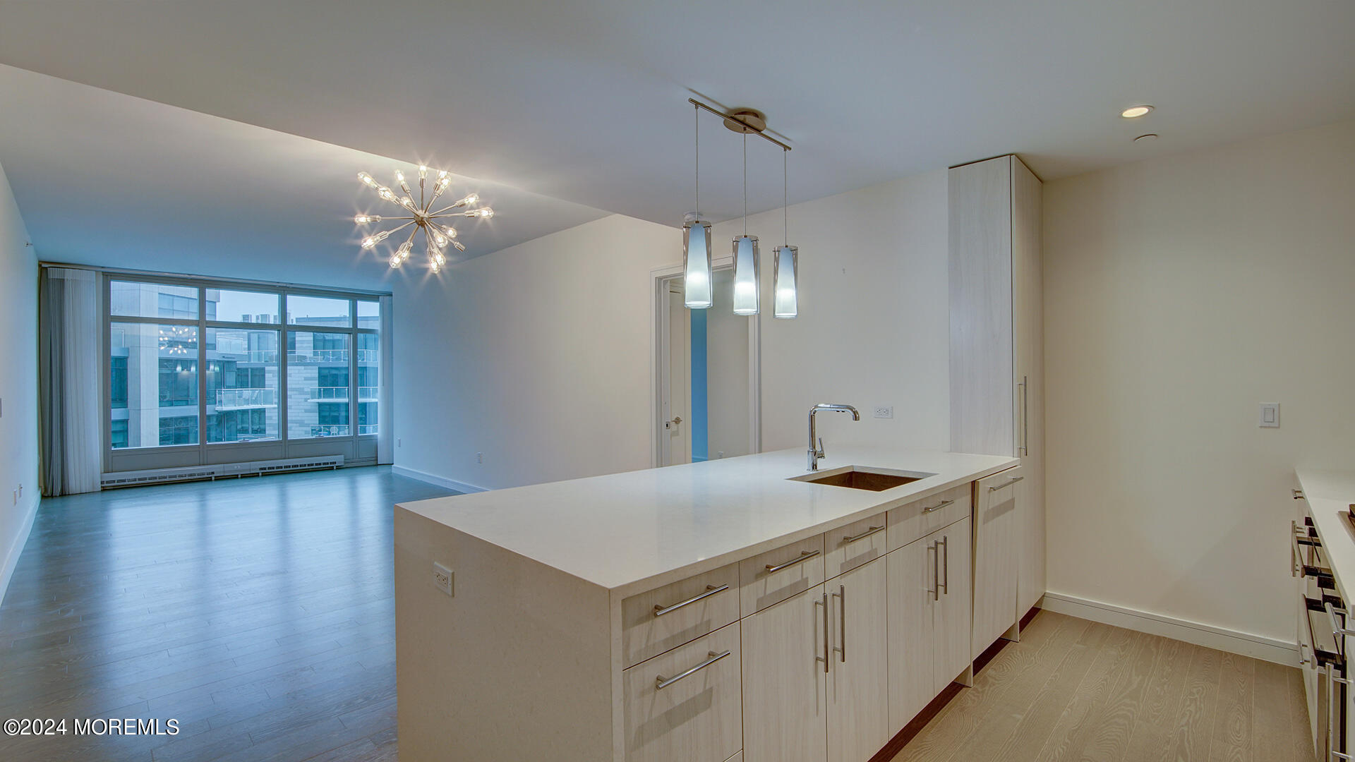 15 Morris Avenue, Unit 507 Long Branch, NJ 07740 - Photo 6 of 52 a kitchen with a sink and chandelier