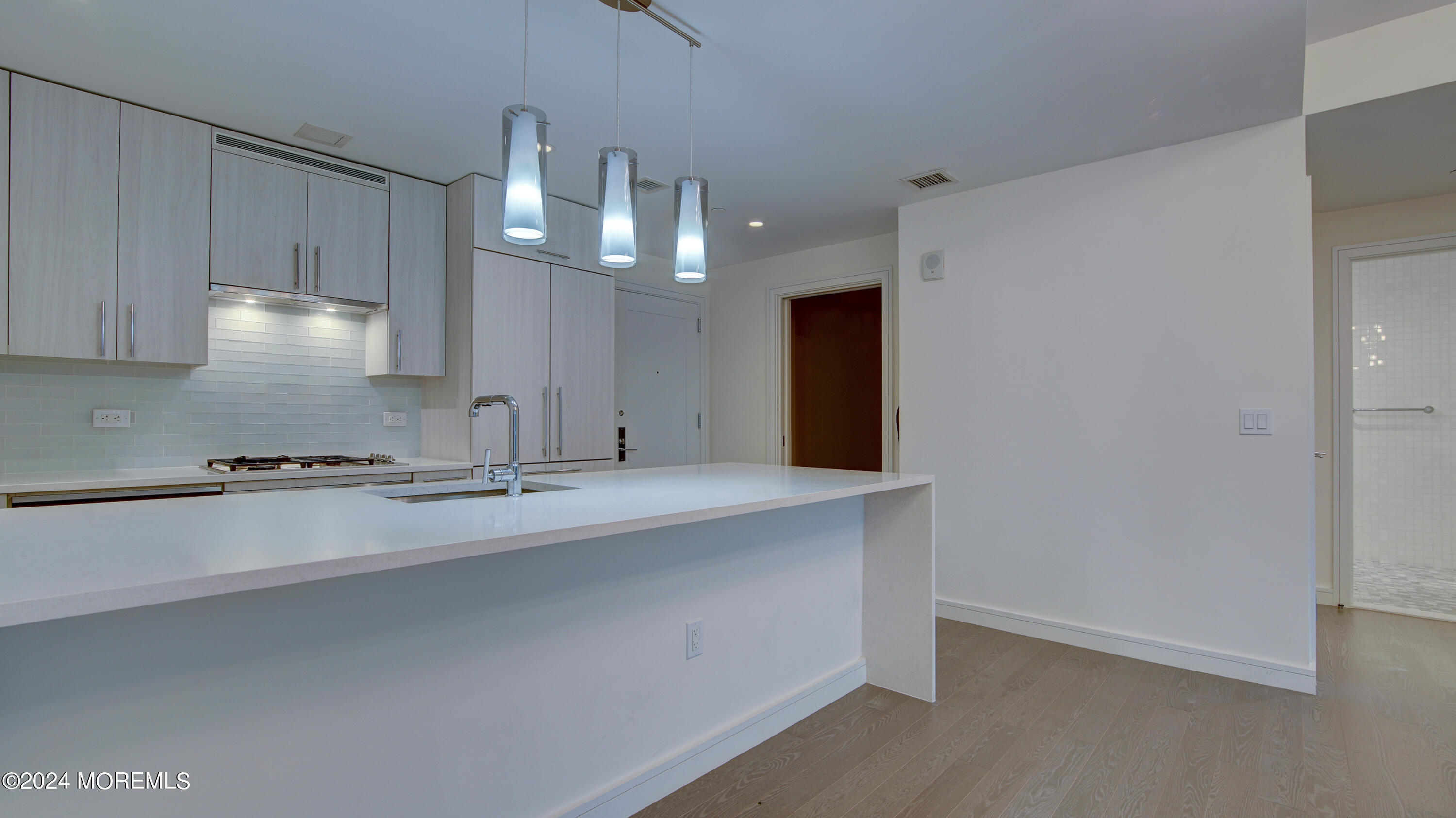 15 Morris Avenue, Unit 507 Long Branch, NJ 07740 - Photo 7 of 52 a kitchen with stainless steel appliances a sink stove and cabinets
