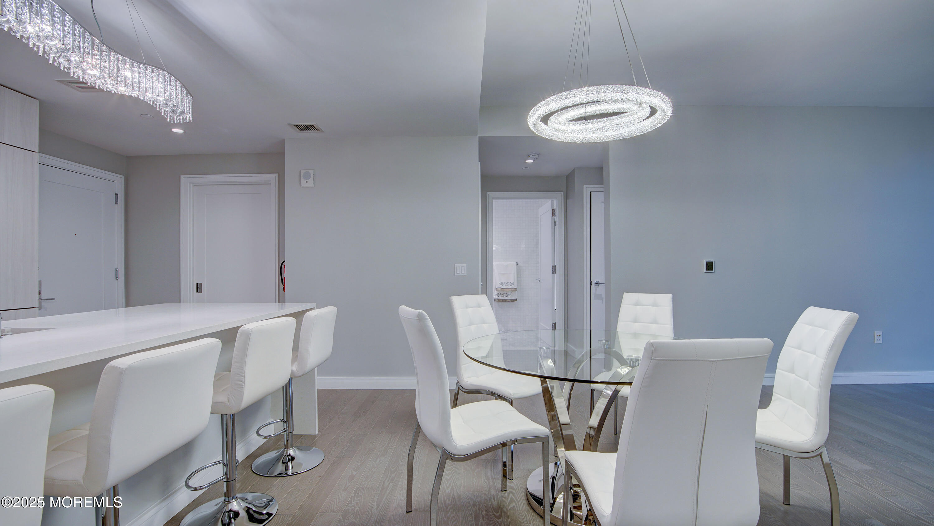 15 Morris Avenue, Unit 507 Long Branch, NJ 07740 - Photo 8 of 52 a view of a dining room with furniture and chandelier