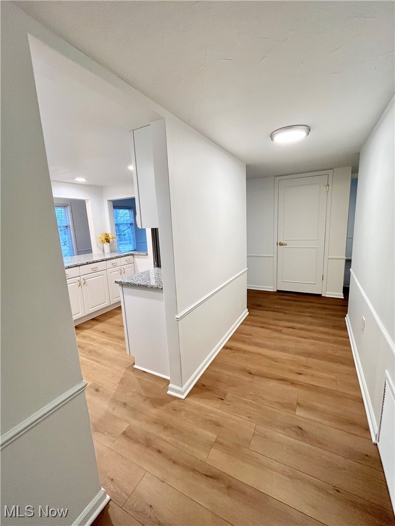 22701 Center Ridge Road, Unit 201 Rocky River, OH 44116 - Photo 3 of 37 Hallway with light hardwood / wood-style flooring