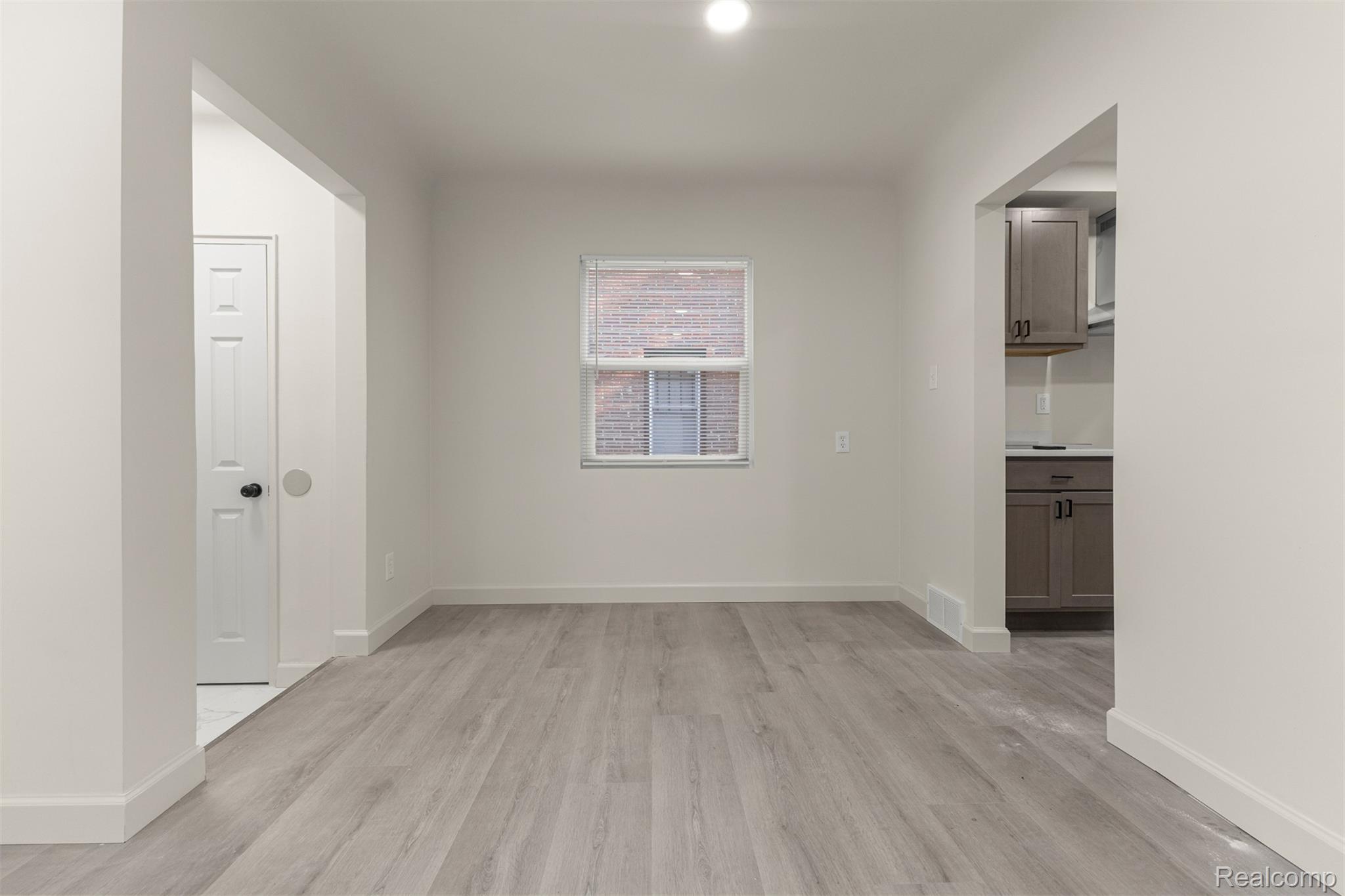 19320 Telegraph Road Detroit, MI 48219 - Photo 5 of 27 Unfurnished room with baseboards and light wood-type flooring