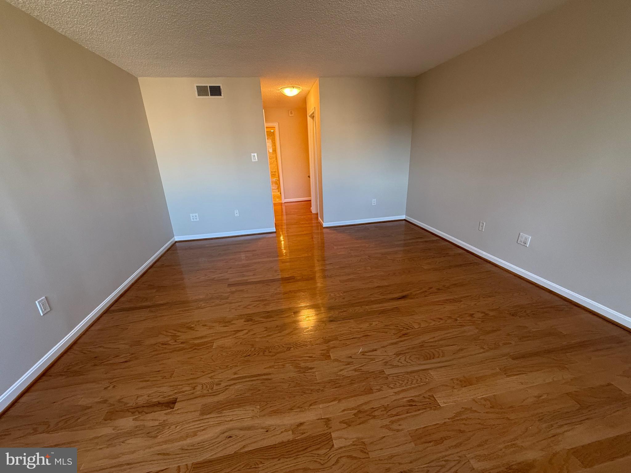 1101 South Arlington Ridge Road, Unit 214 Arlington, VA 22202 - Photo 15 of 41 a view of empty room with wooden floor