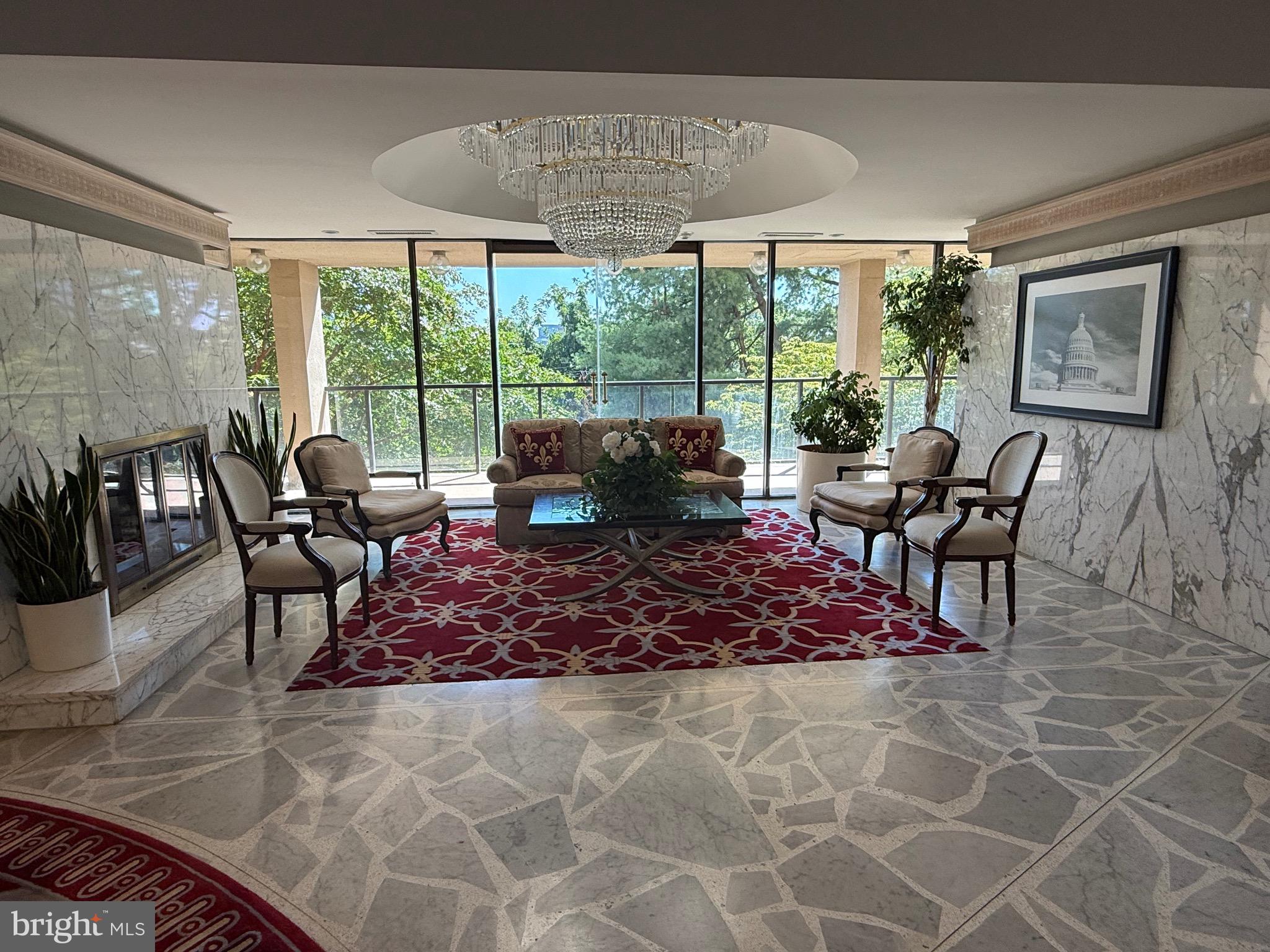 1101 South Arlington Ridge Road, Unit 214 Arlington, VA 22202 - Photo 2 of 41 a living room with furniture and a large window