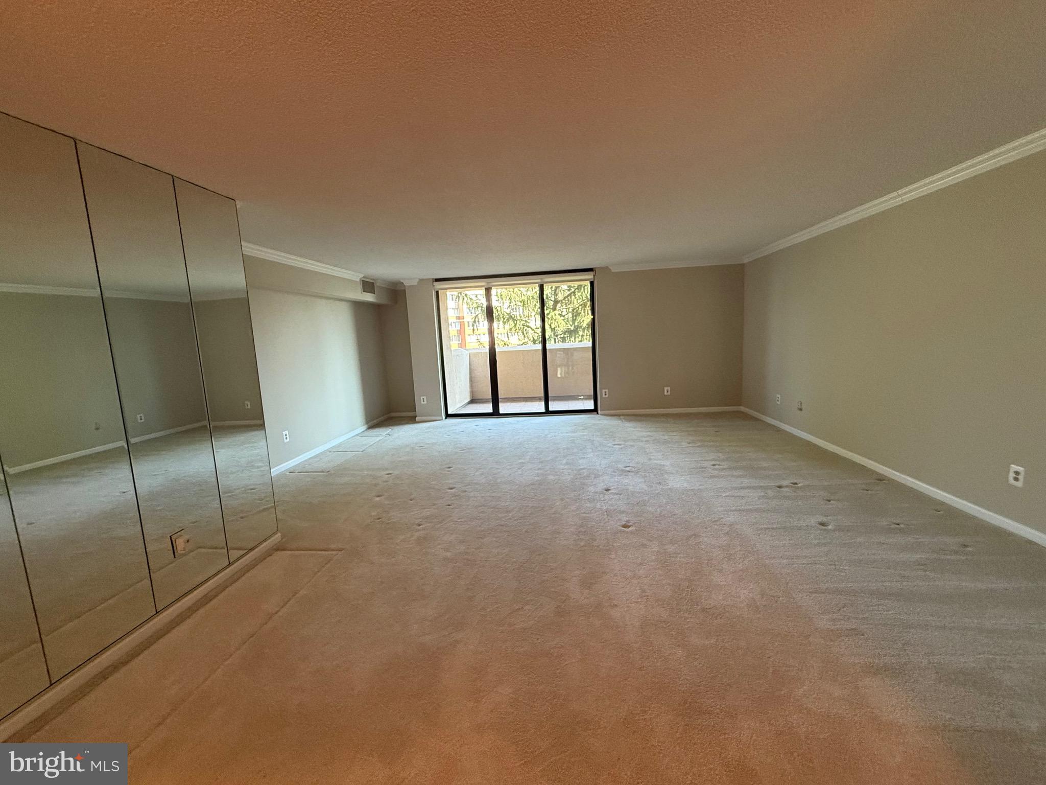 1101 South Arlington Ridge Road, Unit 214 Arlington, VA 22202 - Photo 5 of 41 a view of an empty room with a window